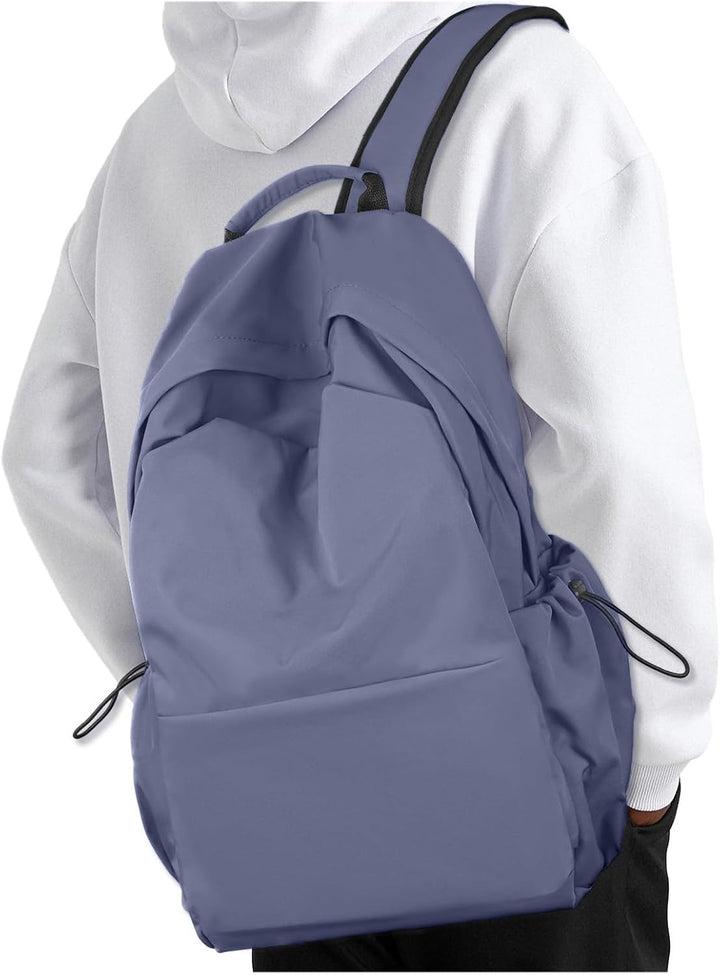 Unisex grey lightweight travel backpack. Water-resistant, organized compartments for daily carry & laptop.