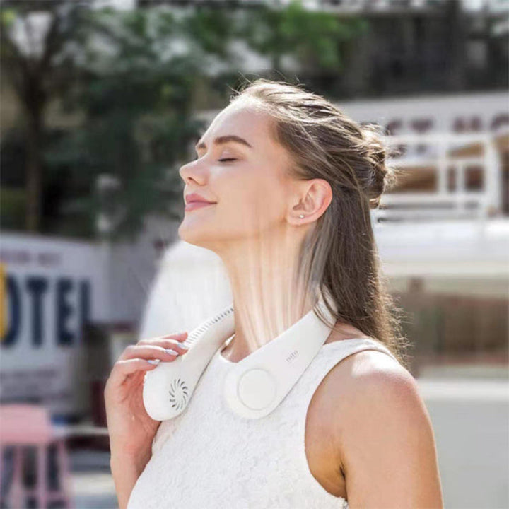Modern bladeless neck fan, lightweight & comfortable, delivers quiet, powerful cooling for sports, work, or travel.