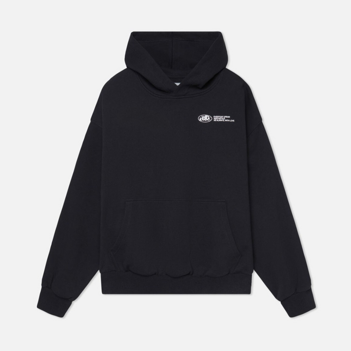 Model wearing a comfortable unisex classic pullover hoodie in a casual, everyday setting.