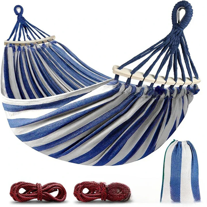 Unisex double canvas hammock with wooden spreader bars for outdoor garden relaxation.