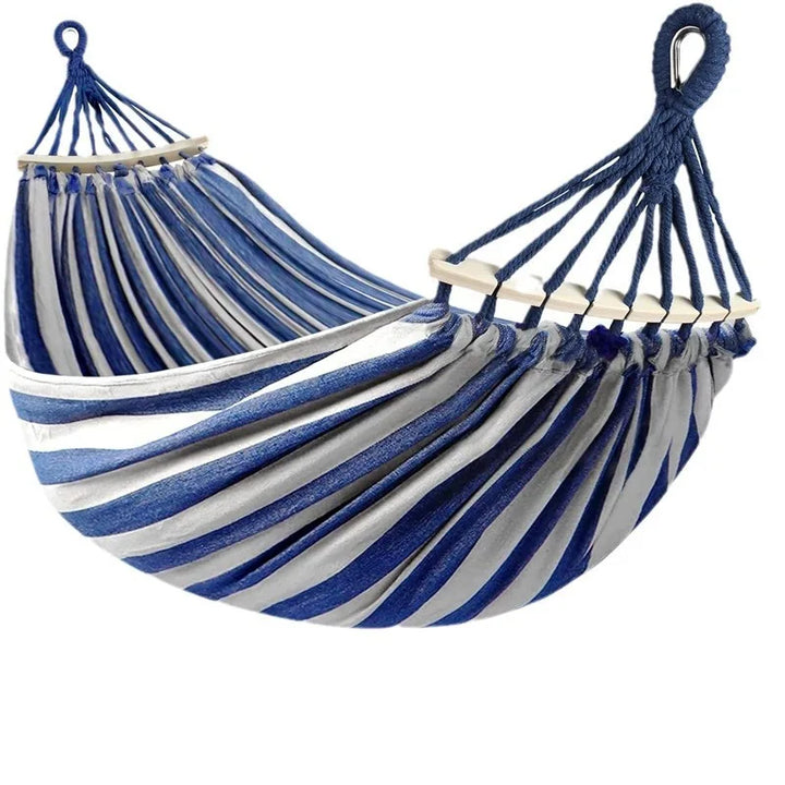 Sturdy double canvas hammock with stylish wooden spreader bars for backyard comfort.