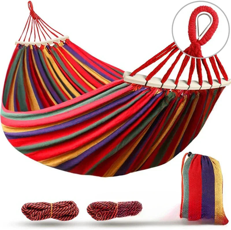 Inviting double canvas hammock & wooden spreaders, perfect for unwinding in your garden or camp.