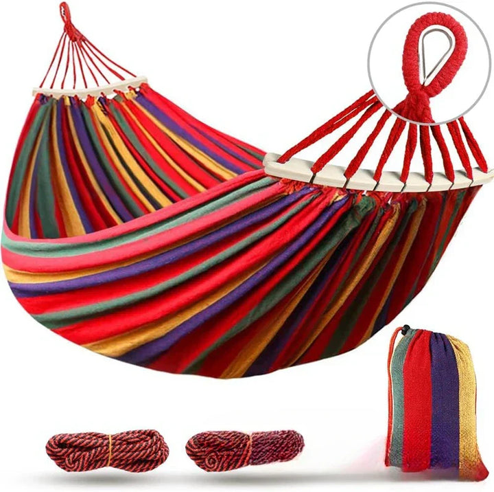 Inviting double canvas hammock & wooden spreaders, perfect for unwinding in your garden or camp.