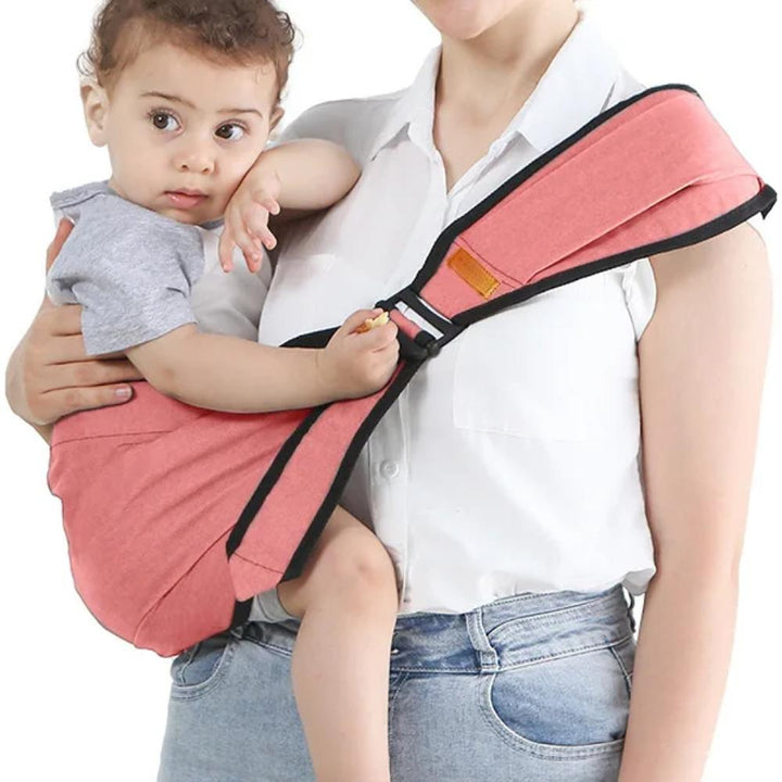 Parent carrying baby in a comfortable, hands-free ergonomic baby carrier with hip seat & stool strap. Unisex toddler essential.