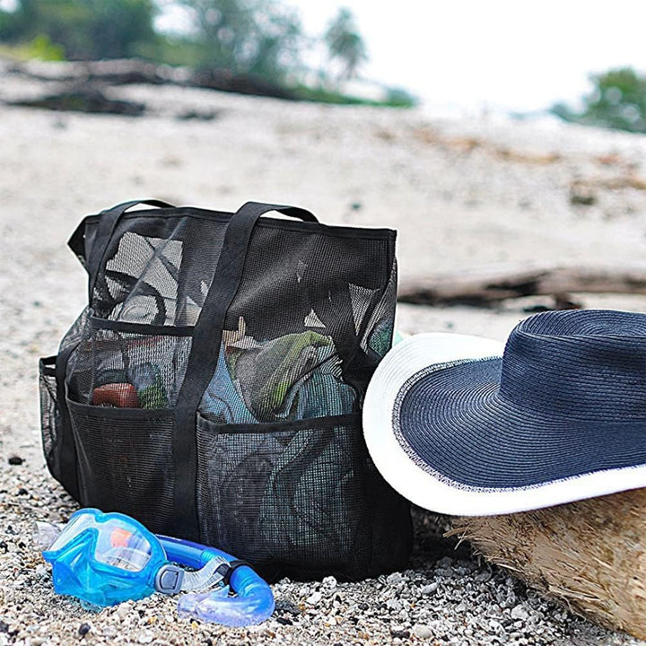Spacious mesh beach tote bag with 9 pockets for all your family's outdoor essentials, foldable for travel.