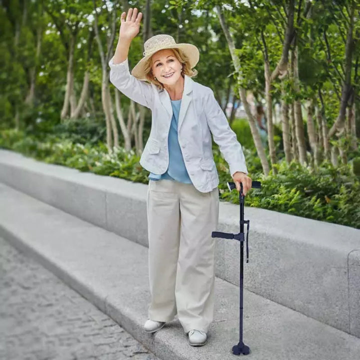 Detail of the LED light on the foldable walking stick, illuminating path with non-slip four-point base.