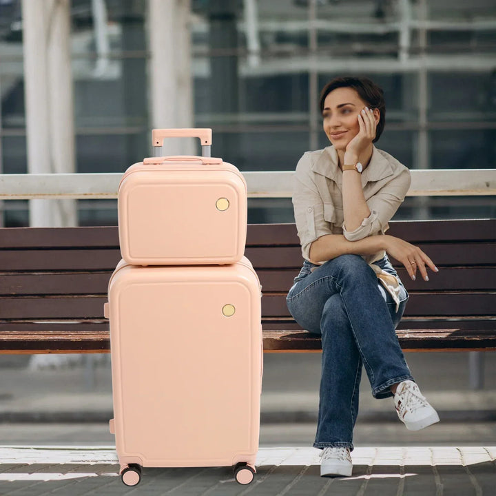 Pink durable hard shell luggage set, Vienna Duo, with smooth 360-degree spinner wheels.