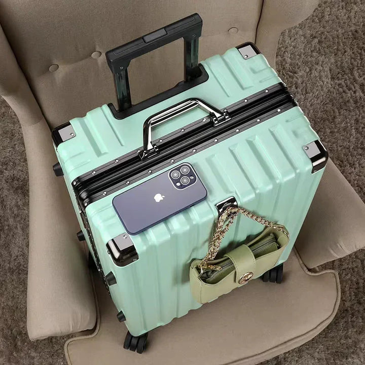 Protective hard shell travel luggage with strong aluminum frame, guarding contents during transit.