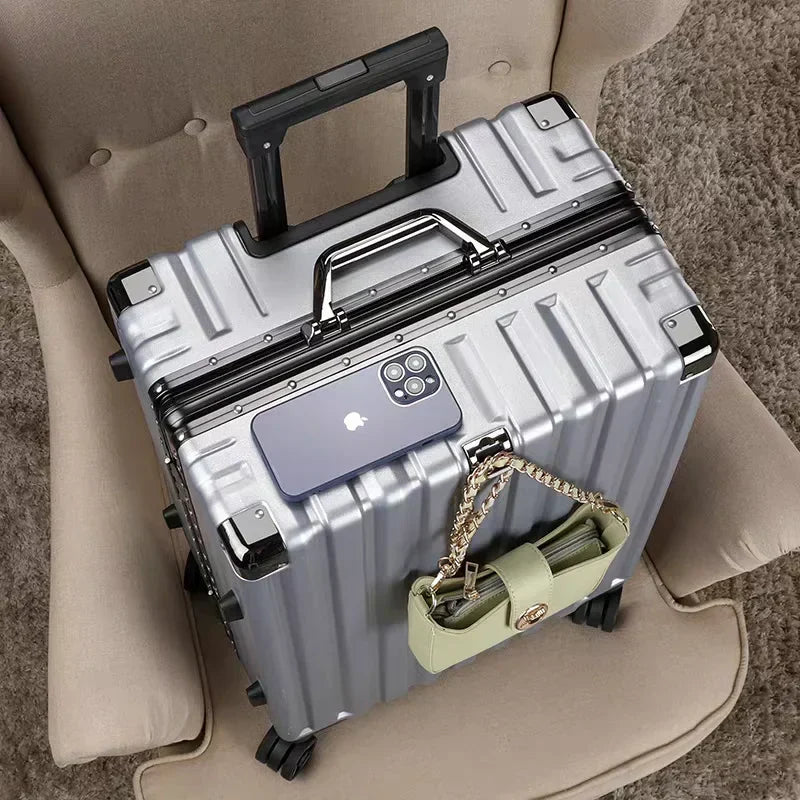 Spacious hard shell travel suitcase with aluminum frame, ideal for packing for any vacation.