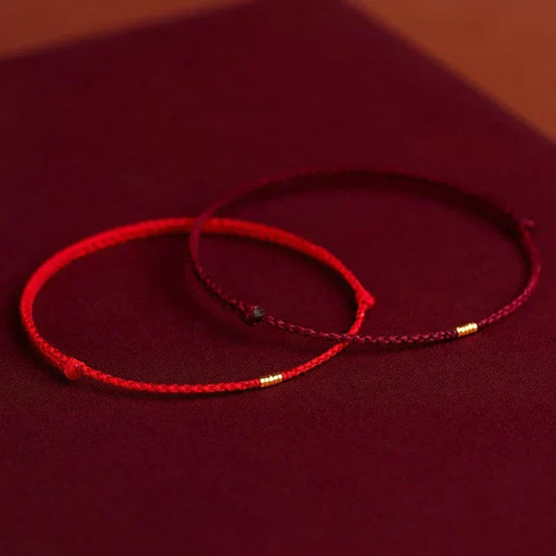 Red & black adjustable Harmony Energy Bracelet. Unisex handcrafted Tibetan blessing for spiritual well-being.