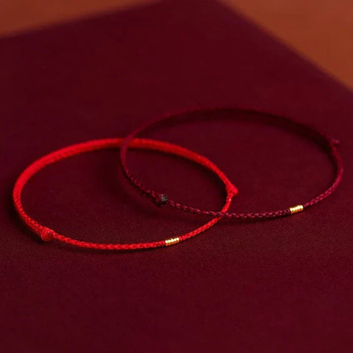 Red & black adjustable Harmony Energy Bracelet. Unisex handcrafted Tibetan blessing for spiritual well-being.
