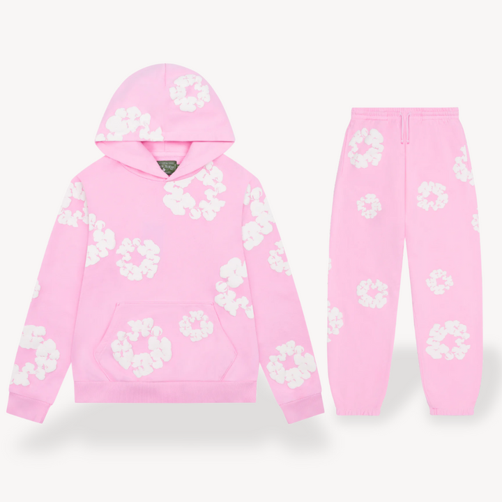 Unisex hoodie with bold white floral graphics on black cotton, combines style and comfort for a standout look.