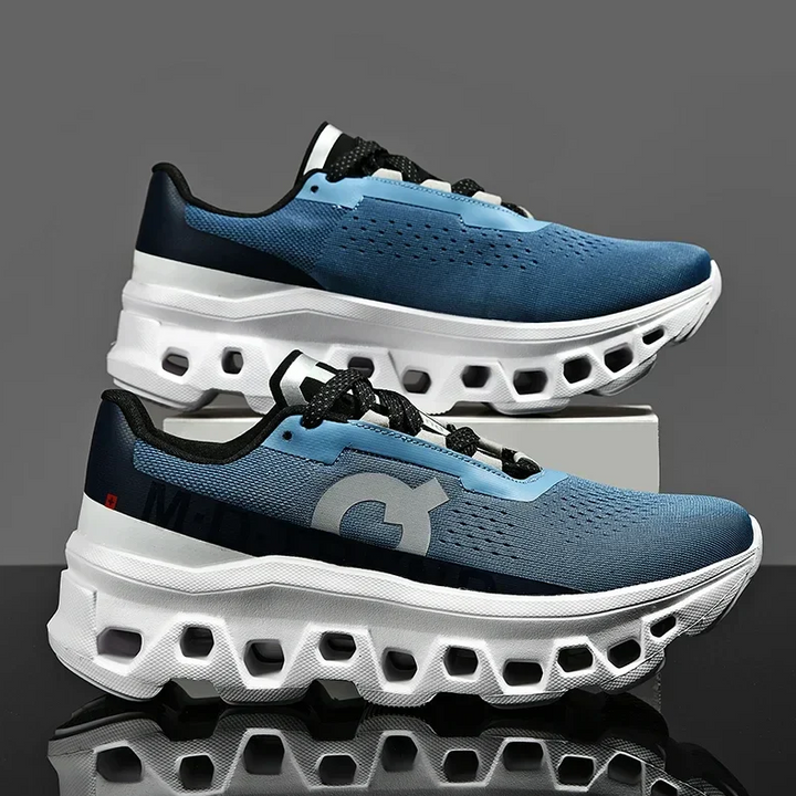Side profile of versatile unisex lightweight running shoes in grey, ideal for running & walking.