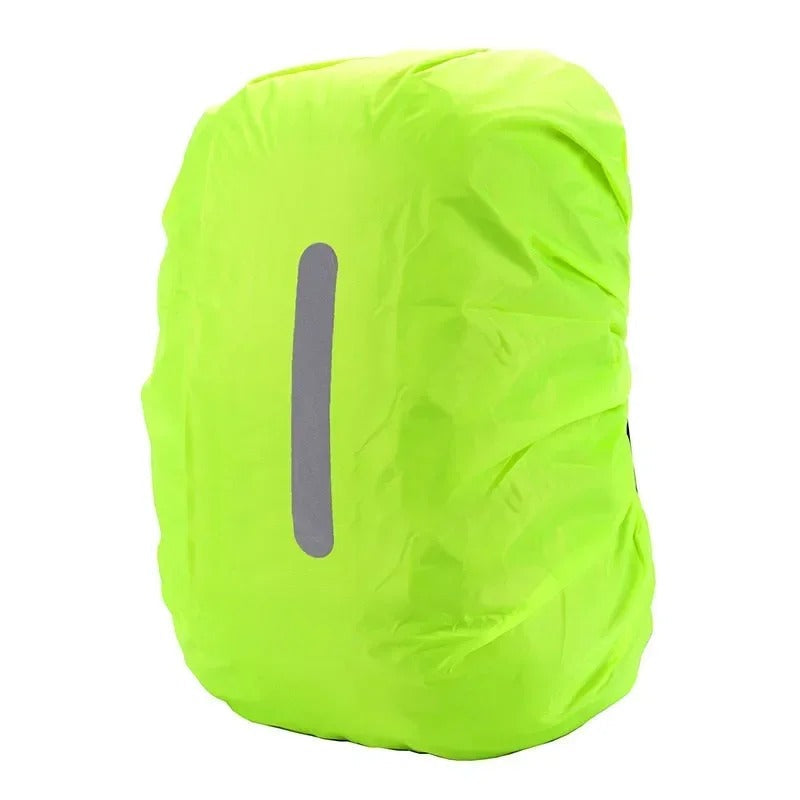 Reflective backpack rain cover protecting a hiking backpack from heavy rain on a trail.