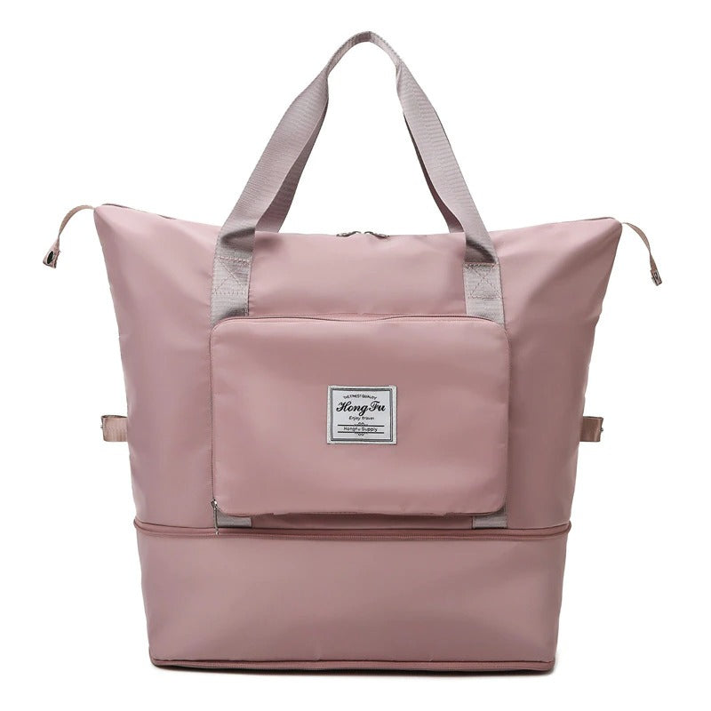 Expandable weekender travel bag in sleek black, waterproof & durable. Ideal carry-all for men and women.