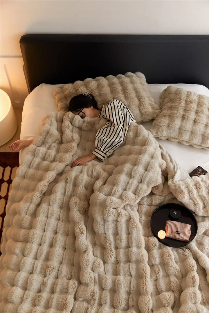 Unisex plush fleece throw blanket in gray, perfect for cozy warmth in living room or bedroom.