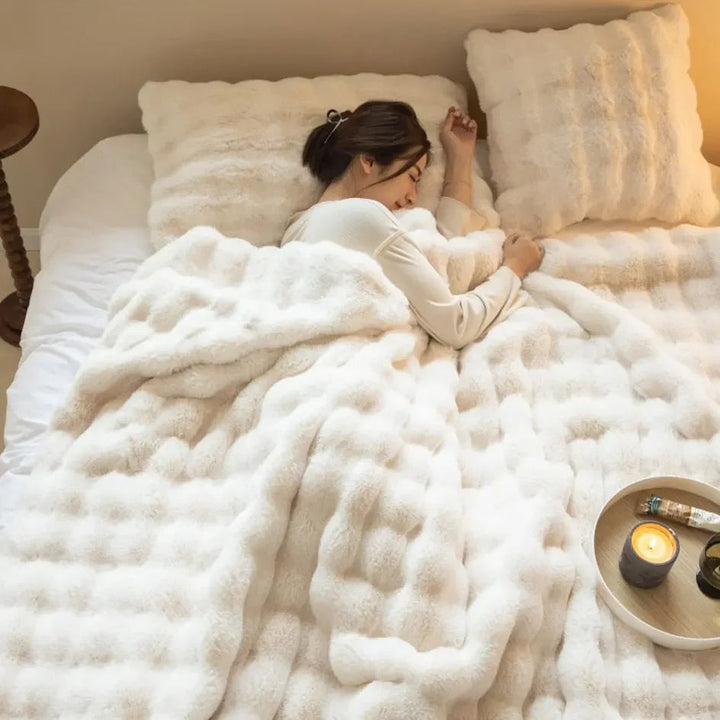 Warm fleece throw blanket, perfect for snuggling. Soft, comfortable, and stylish home decor.