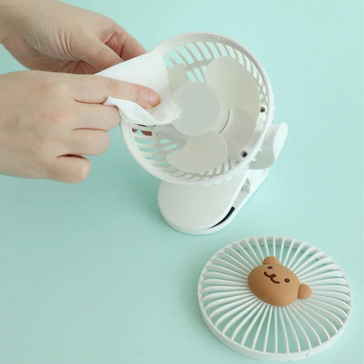 Compact unisex portable clip-on fan with USB rechargeable battery, ideal for travel & outdoor essentials.
