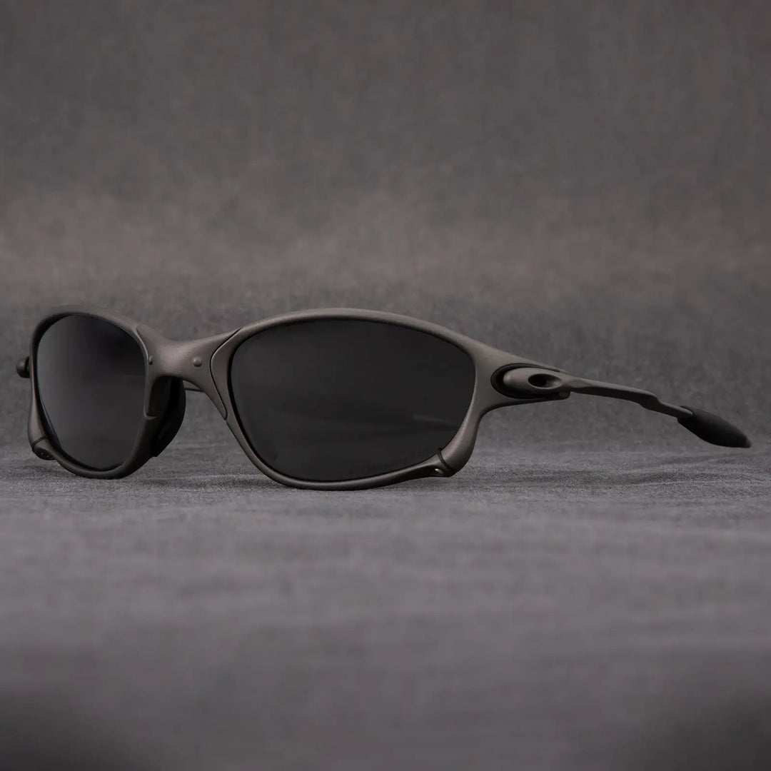 Modern unisex polarized sunglasses: lightweight metallic frame & striking red lenses. Great for beach, sport, & glare reduction.