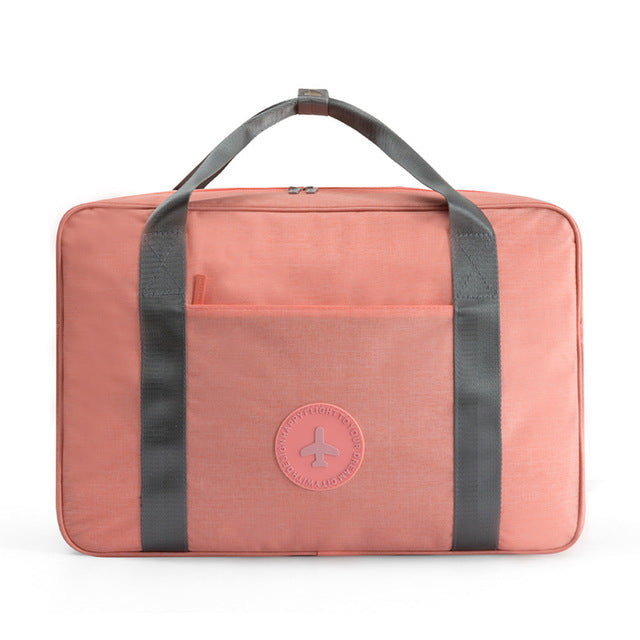 Compact universal carry-on suitcase attachment for organized airport travel & overhead bag use.