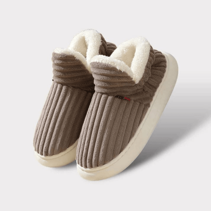 Warm comfort slippers, unisex design with non-slip sole for indoor wear.