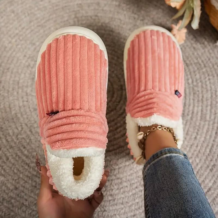 Warm winter indoor slippers, machine washable & cushioned for comfort.