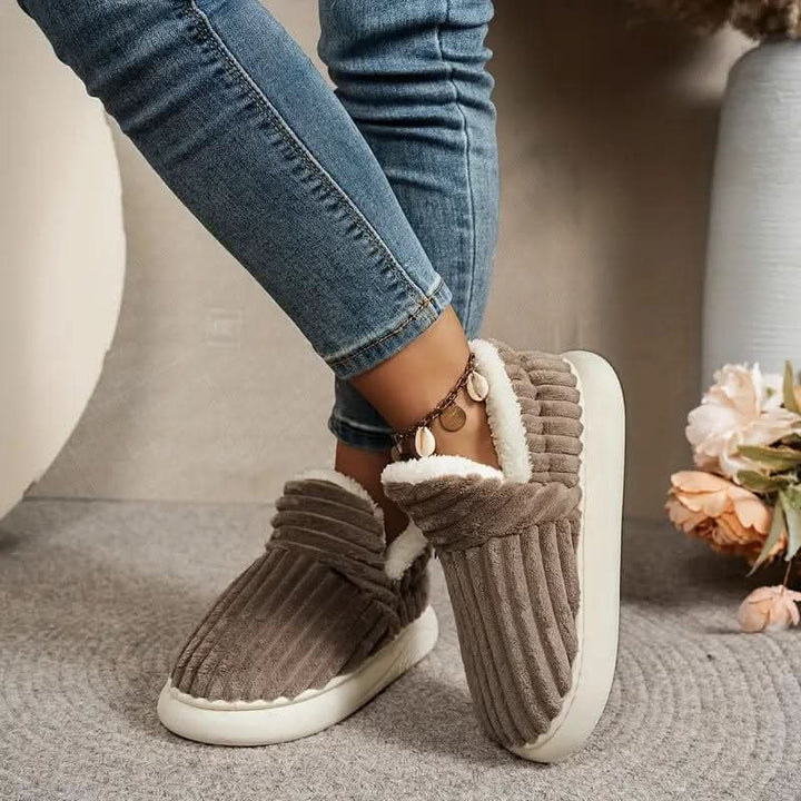 Plush unisex slippers with thermal lining, ideal for winter warmth & comfort at home.