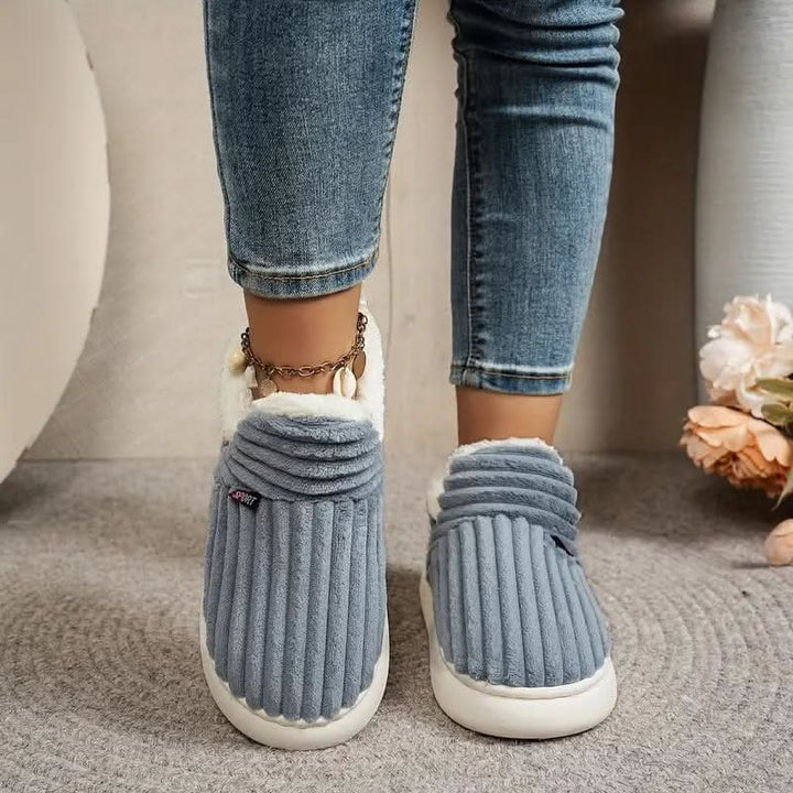 Unisex warm slippers with cushioned support; perfect for cozy indoor comfort.