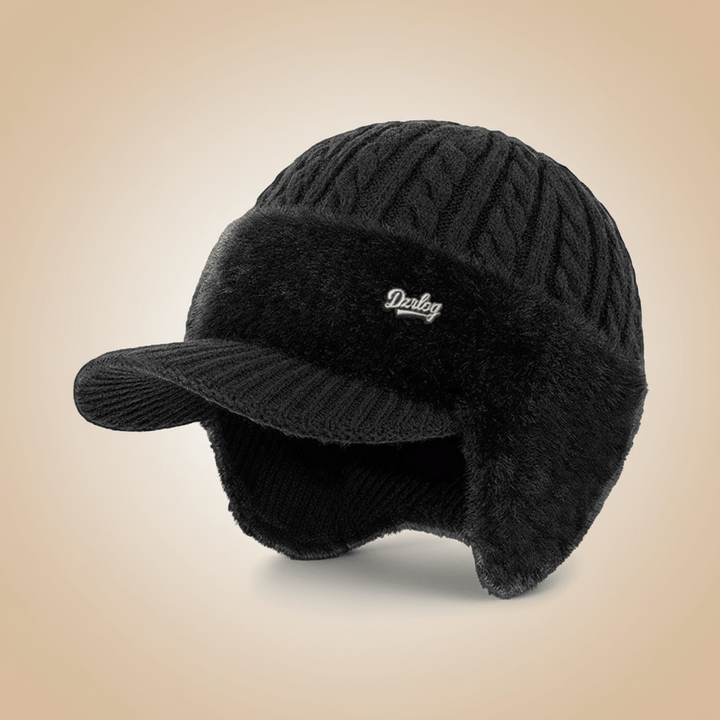 Cozy unisex trapper hat, ideal for snowy conditions. Features warm ear protection and durable cold weather headwear.