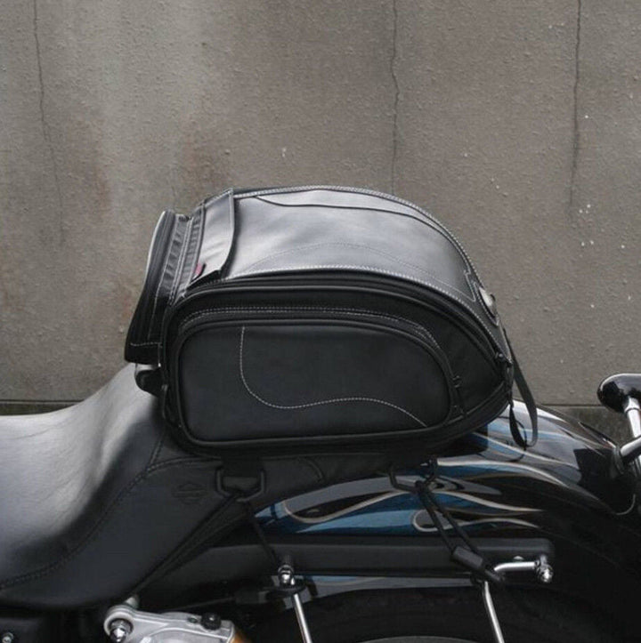 Sleek black motorcycle tail bag, universal fit for all bikes. Secure water-resistant storage for essentials.