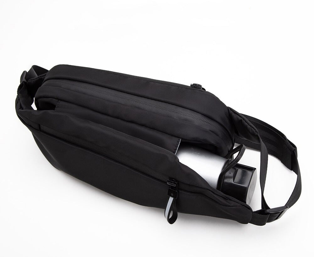 Unisex multi-pocket fanny pack, water-resistant, great for active travel.