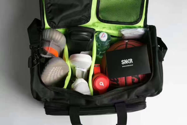 Modern water-resistant gym & travel duffel bag with dedicated sneaker compartments.