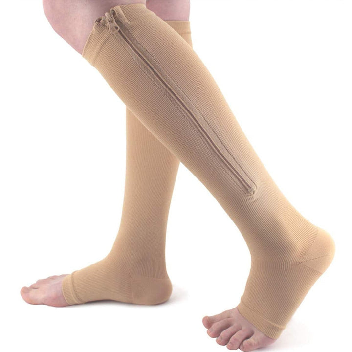 Knee-high compression socks with zipper for leg relief, swelling reduction, and vein support.