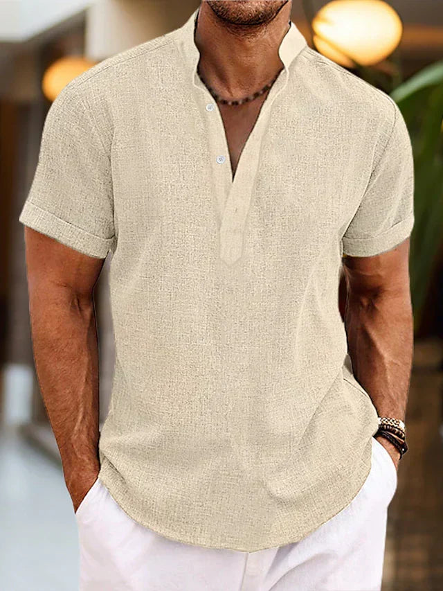Man wearing a smart V-neck polo shirt, showcasing classic style & casual comfort. Perfect for summer outings.