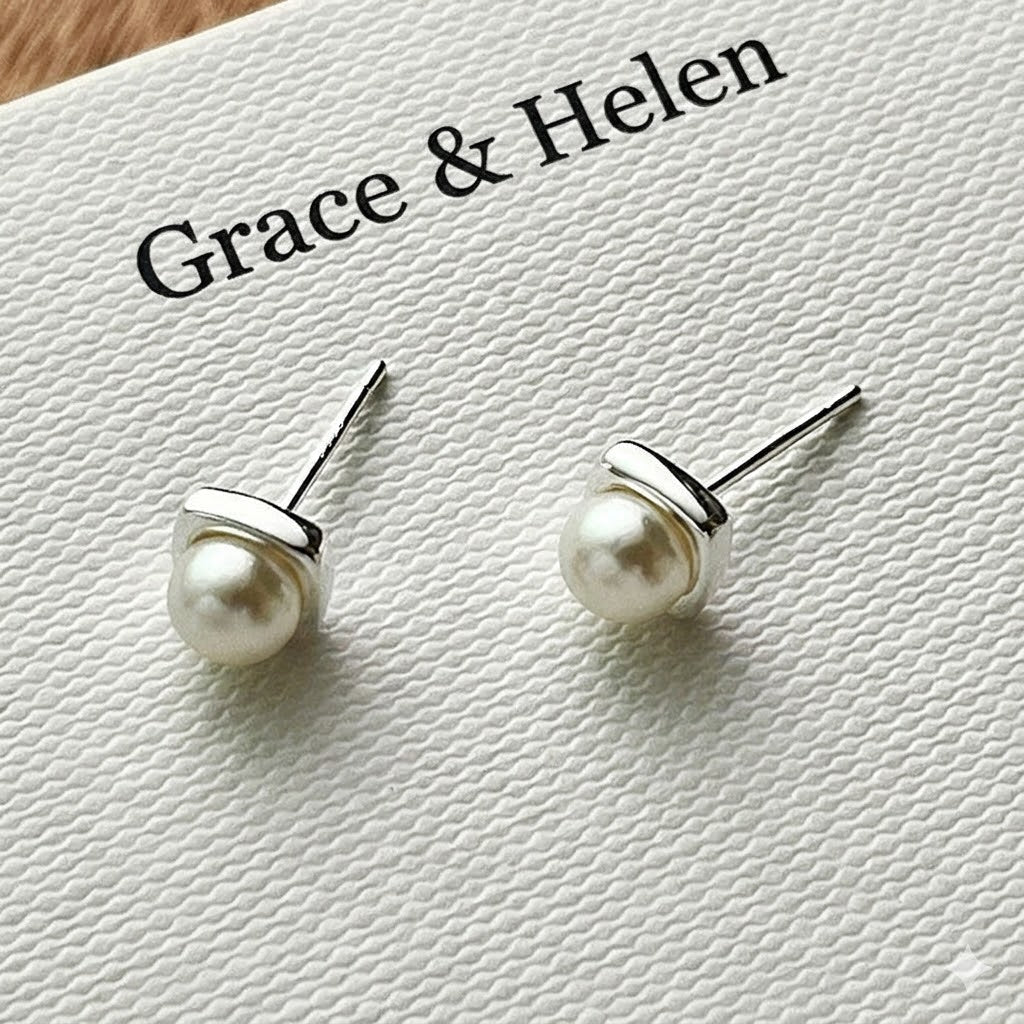 Lustrous freshwater pearl drop earrings. Classic women's jewelry, sophisticated and perfect for any occasion.