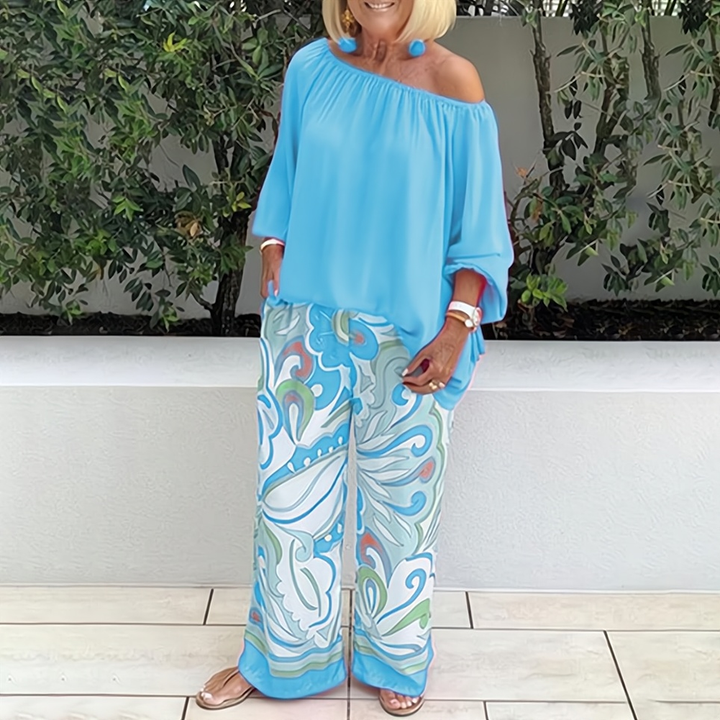 Chic women's wide-leg pants and top set. Relaxed fit two-piece outfit, ideal for elegant summer fashion.