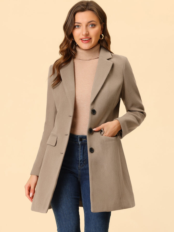Tailored women's long-sleeve winter coat. Classic collared, elegant for cold weather business casual.