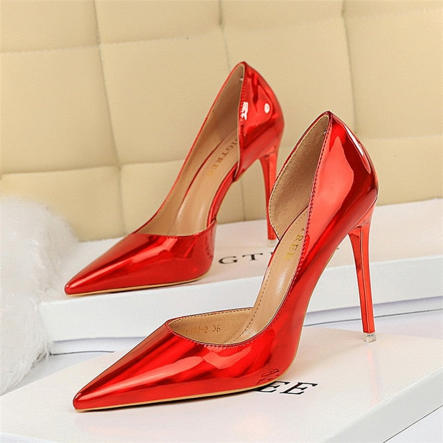 Elegant white pointed toe pumps with a slim stiletto heel for brides or formal parties.