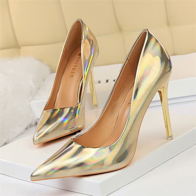 Glistening gold pointed toe high heel pumps for women, elegant party and evening wear.