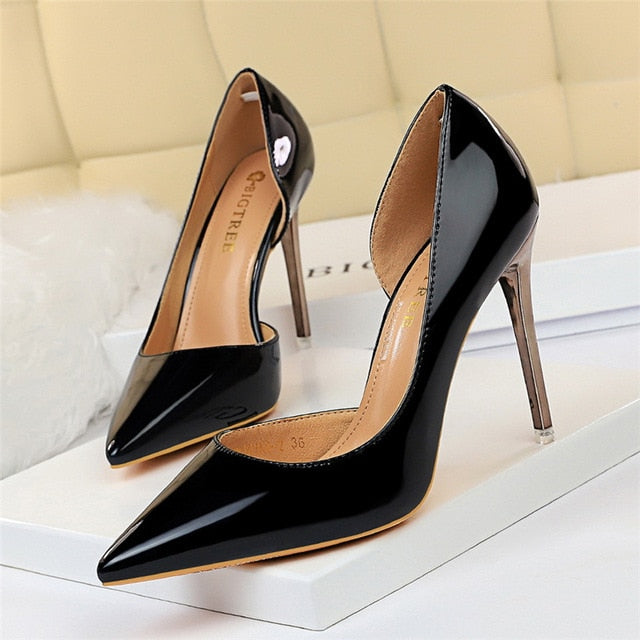 Women's confident black pointed toe pumps, leather, slim high heel, fashion footwear.