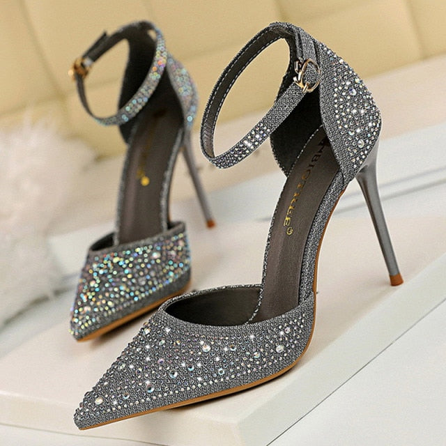 Dazzling rhinestone stiletto sandals for women, featuring a sophisticated ankle strap, perfect for evening.