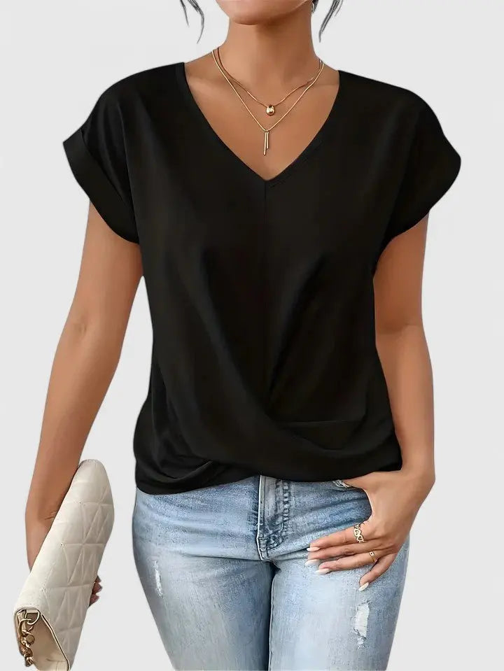 Stylish ladies V-neck short sleeve top with twist front; a chic blouse for casual outings and versatile styling.
