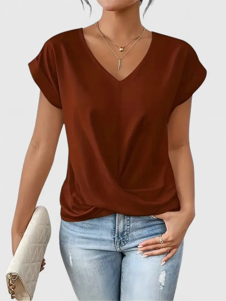 Twist front detail on a women's V-neck short sleeve top, offering a comfortable and fashionable everyday look.