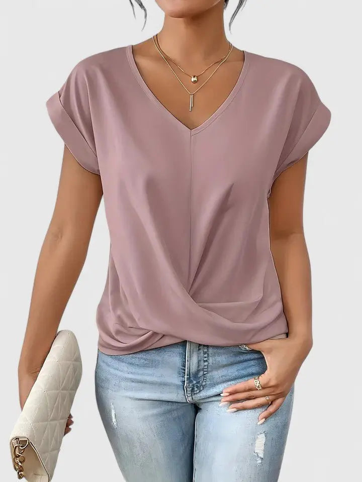 Soft, relaxed fit women's V-neck short sleeve top with elegant twist front, great for casual comfort.