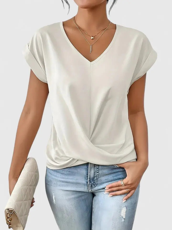 Modern V-neck short sleeve women's top featuring a fashionable twist front, perfect for versatile casual wear.