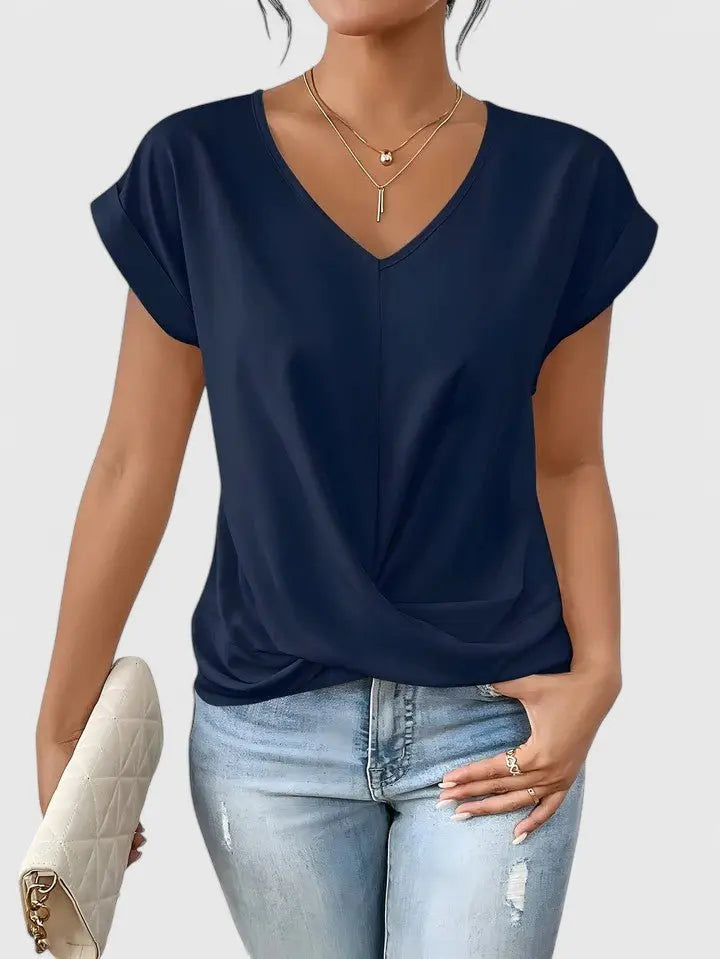 Casual women's short sleeve V-neck top with a trendy twist front design. Relaxed fit ladies' everyday wear.