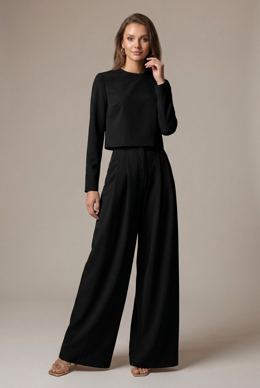 Full shot: elegant wide-leg palazzo pants & crop top outfit for women. Chic two-piece set for all seasons.