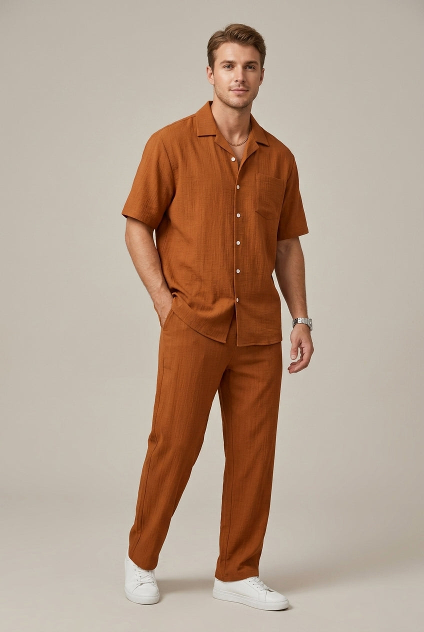 Men's fashion coordinated two-piece set: a textured short-sleeve shirt and matching drawstring trousers for casual wear.