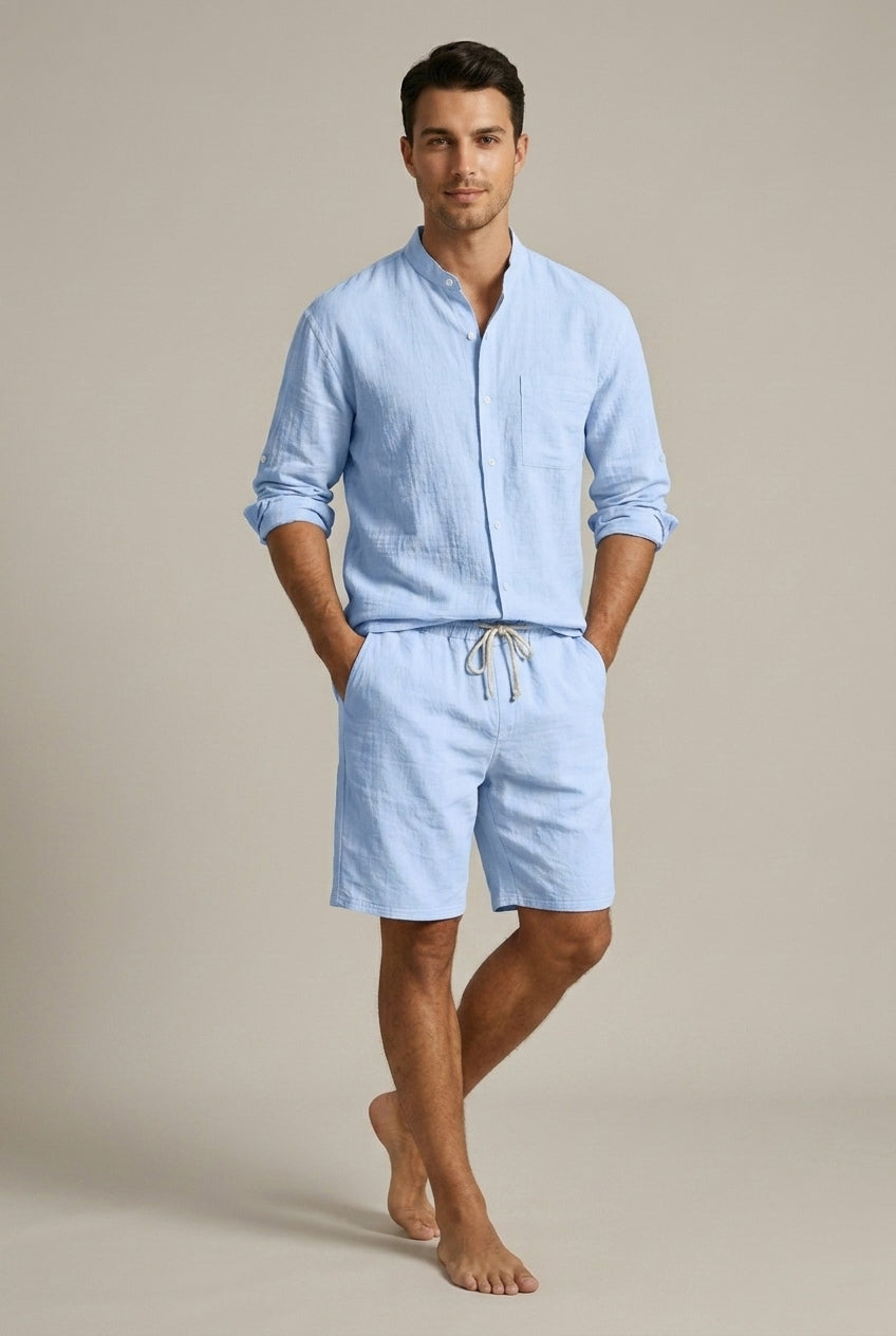 Coordinated men's summer outfit: soft band collar shirt & drawstring shorts for relaxed holiday style.