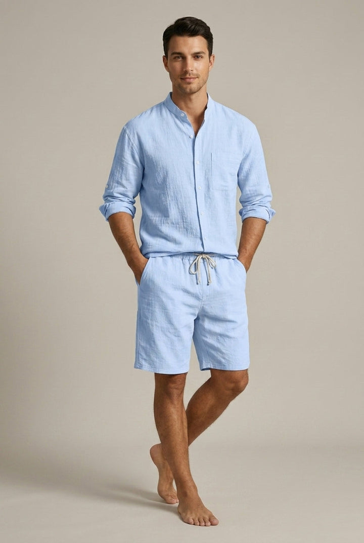 Coordinated men's summer outfit: soft band collar shirt & drawstring shorts for relaxed holiday style.